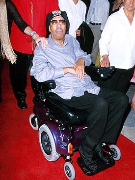 Richard Pryor in een rolstoel